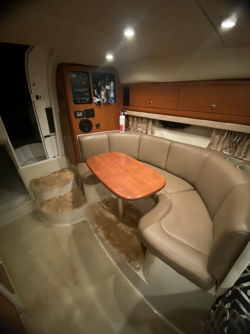 Slide: The Image of 2003 Chaparral Signature 280 interior with cozy seating and wooden table. - 15