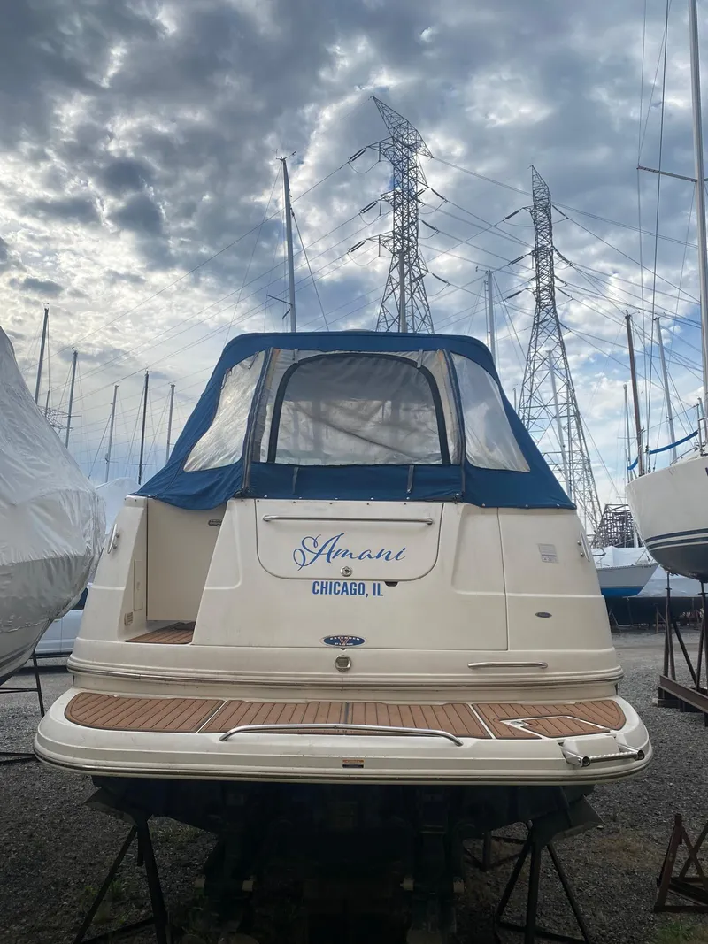 Slide: The Image of 2003 Chaparral Signature 280 boat docked under cloudy skies. - 17