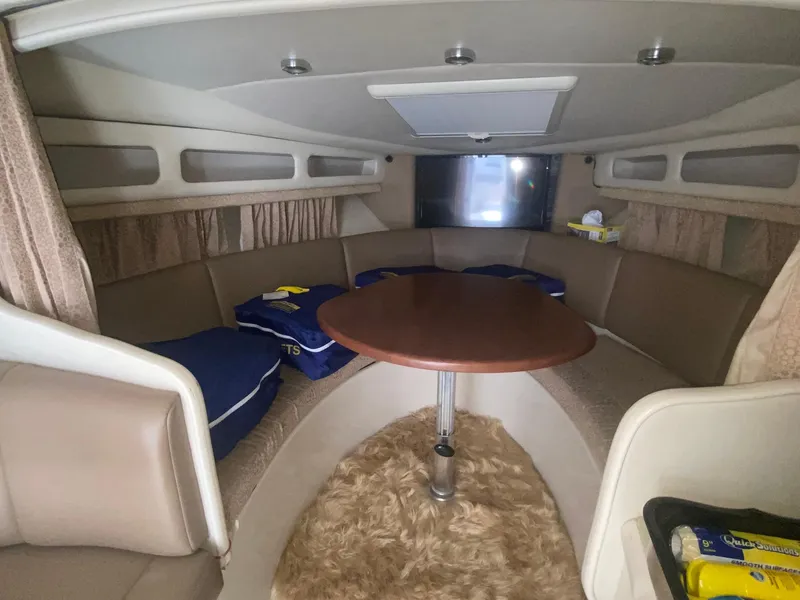 Slide: The Image of 2003 Chaparral Signature 280 cabin interior with round table and seating area. - 20