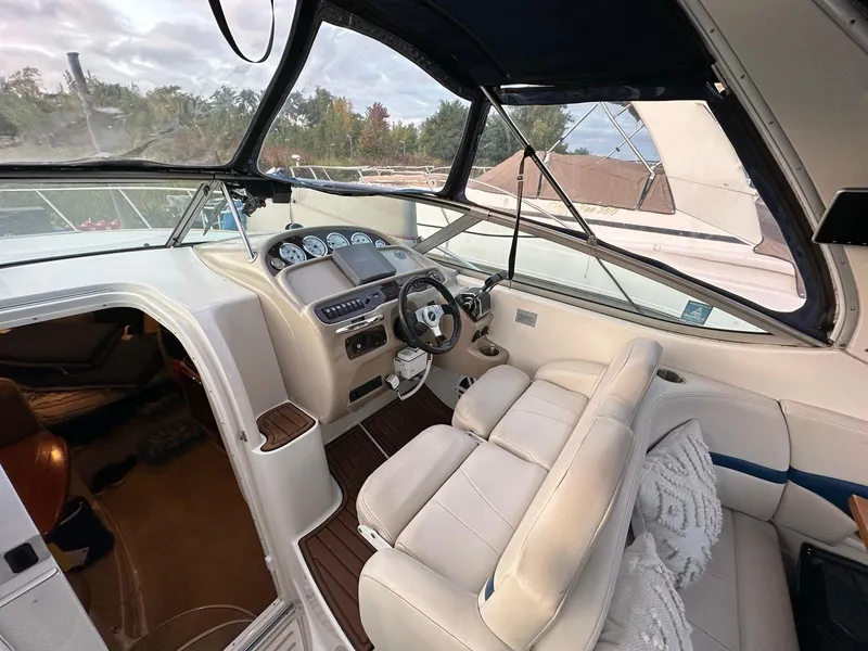 Slide: The Image of 2003 Chaparral Signature 280 boat interior with steering wheel and dashboard. - 26