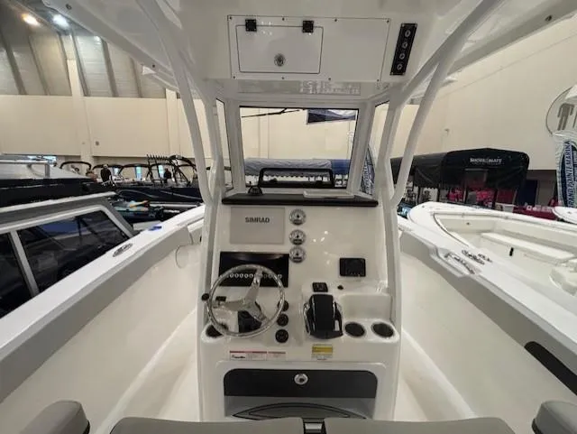 Slide: The Image of 2025 Sea Pro 262 Offshore boat interior with sink and motor detail. - 16