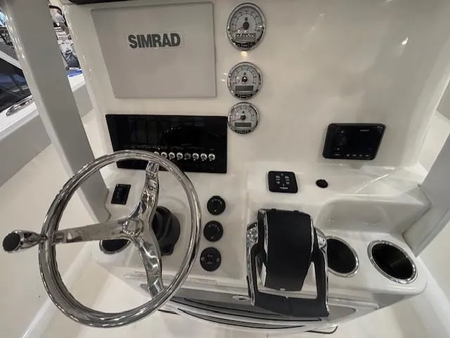 Slide: The Image of 2025 Sea Pro 262 Offshore boat deck with storage compartments and dual engines. - 17