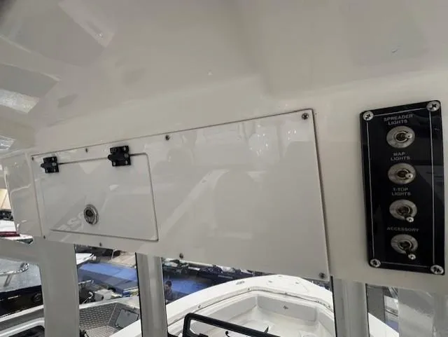 Slide: The Image of 2025 Sea Pro 262 Offshore boat interior with foldable seating and dual outboard motors. - 19