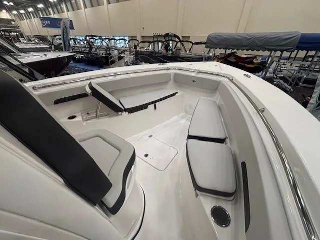 Slide: The Image of 2025 Sea Pro 262 Offshore boat interior with dual seats and steering wheel. - 24