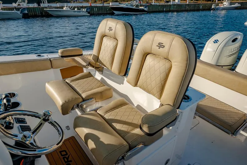 Slide: The Image of 2025 Sea Pro 262 Offshore boat interior with cushioned seating and sleek design. - 33