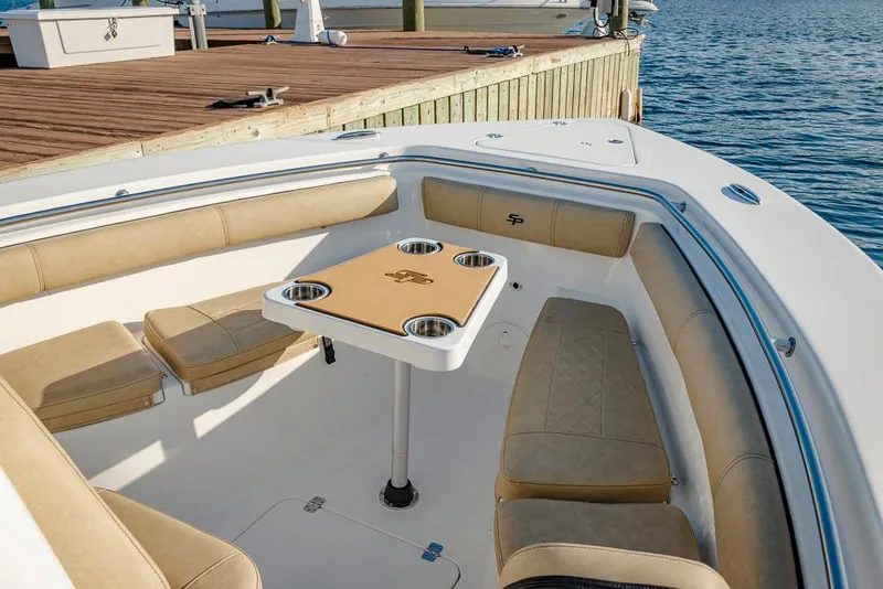 Slide: The Image of 2025 Sea Pro 262 Offshore boat interior with seating and storage compartments. - 34