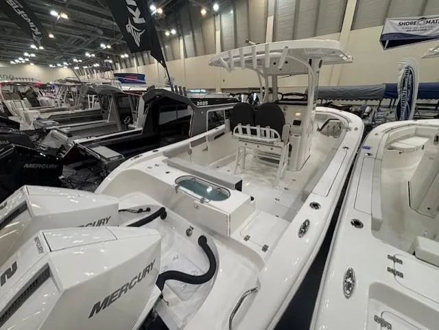 Slide: The Image of 2025 Sea Pro 262 Offshore boat on trailer in showroom. - 4