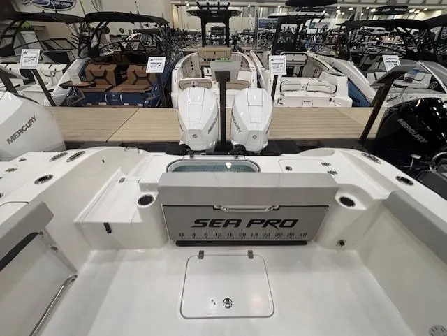 Slide: The Image of 2025 Sea Pro 262 Offshore boat on trailer in indoor showroom. - 5