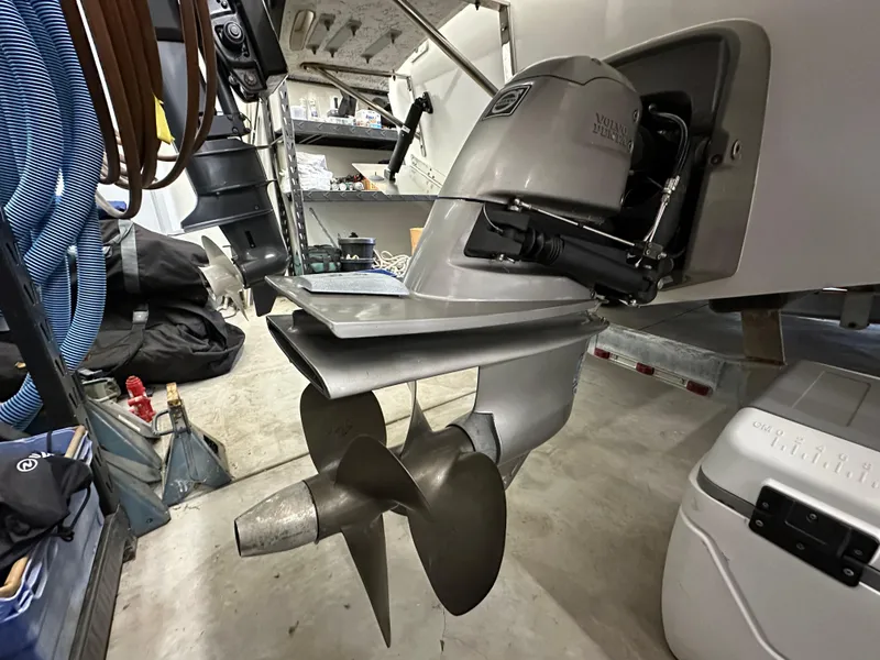 Slide: The Image of Close-up of a 2005 Farallon 28 boat's outboard motor in a garage. - 15