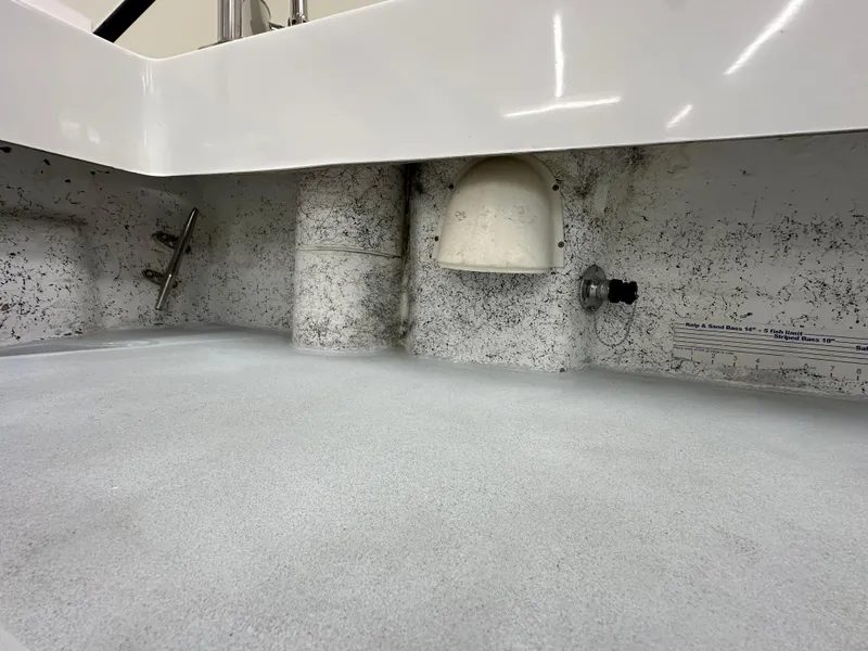 Slide: The Image of 2005 Farallon 28 boat interior detail, showing textured surface and fittings. - 23