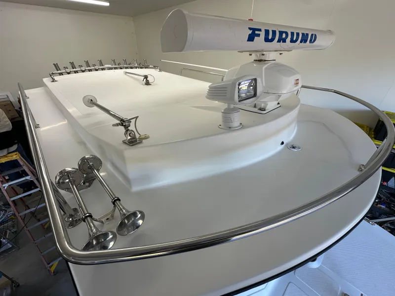 Slide: The Image of Farallon 28 boat roof with Furuno radar, 2005 model, featuring stainless steel railings and horns. - 24