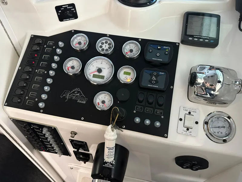 Slide: The Image of Control panel of a 2005 Farallon 28 boat with gauges and switches. - 31