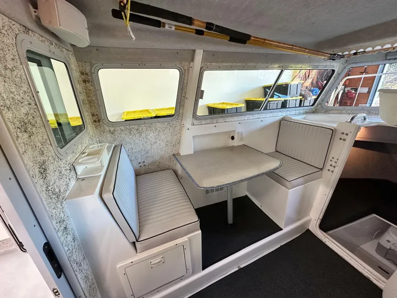 Slide: The Image of Interior of a 2005 Farallon 28 boat with seating and table. - 37