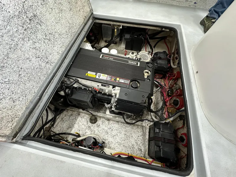 Slide: The Image of Engine compartment of a 2005 Farallon 28 boat, showing detailed wiring and components. - 43