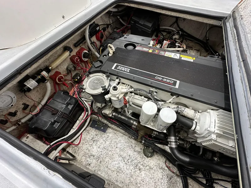 Slide: The Image of Engine compartment of a 2005 Farallon 28 boat, showcasing detailed mechanical components. - 44