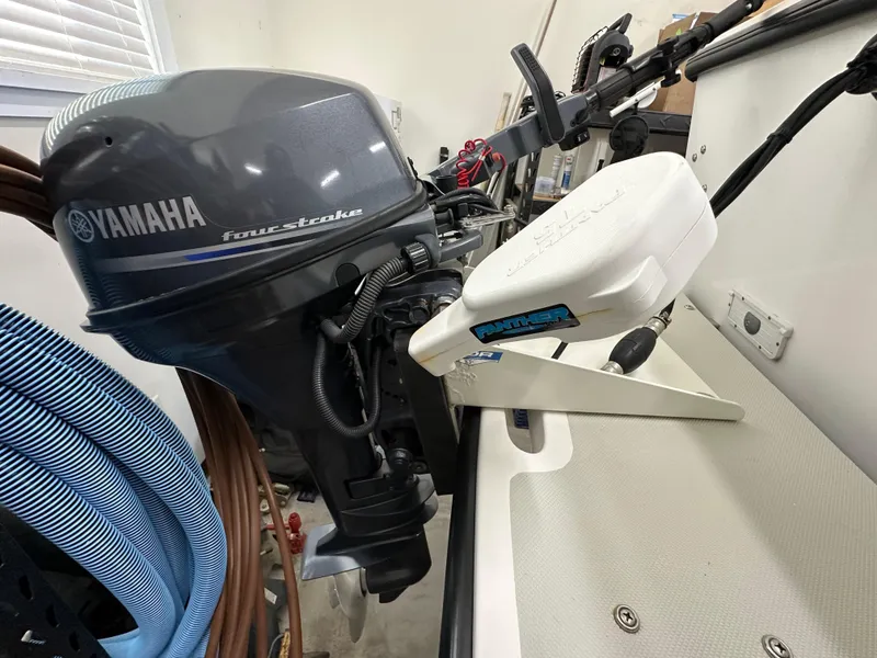 Slide: The Image of Yamaha four-stroke outboard motor on a 2005 Farallon 28 boat. - 45