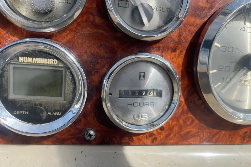 Slide: The Image of Instrument panel of a 1997 Bayliner 2655 Ciera boat showing gauges and displays. - 19