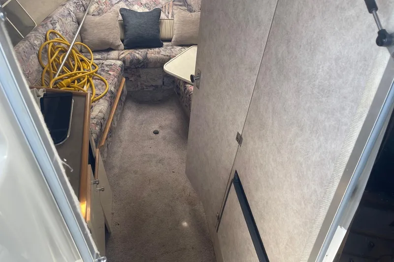 Slide: The Image of Interior of 1997 Bayliner 2655 Ciera boat with seating and storage. - 20