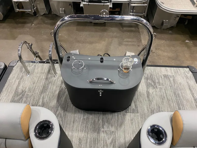 Slide: The Image of 2025 Avalon 2585 Catalina QLW boat interior with seating and control panel. - 5