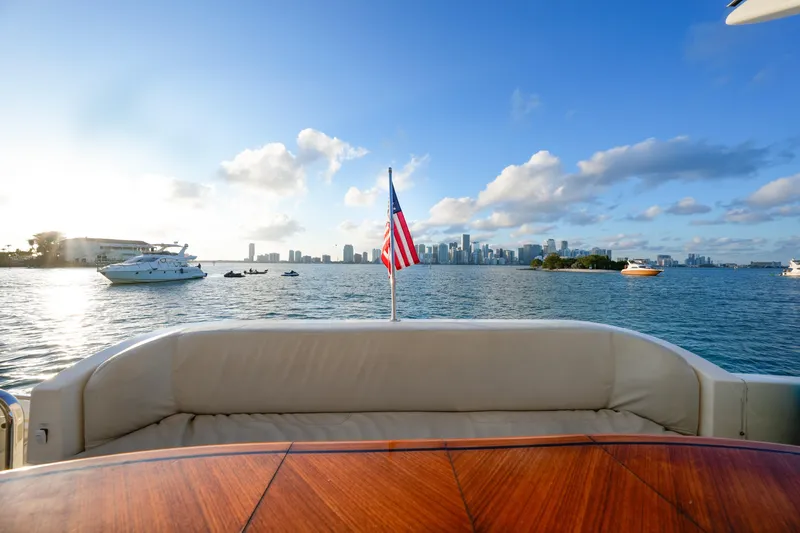 Slide: The Image of View from 2007 Azimut 68E yacht, overlooking city skyline and ocean with American flag. - 19
