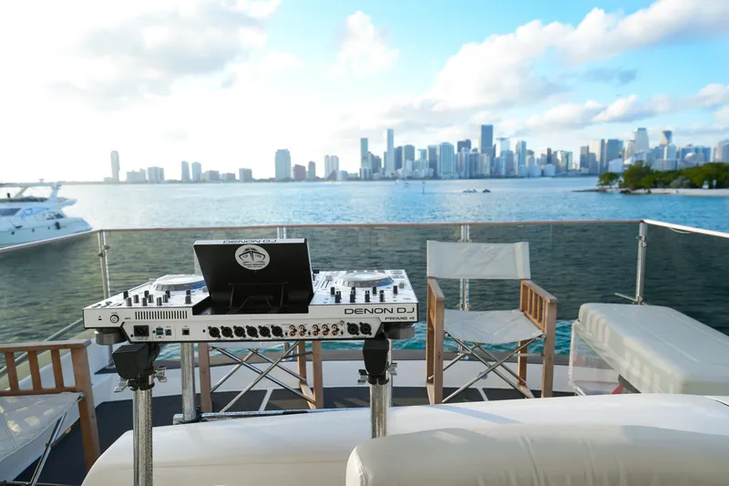 Slide: The Image of DJ setup on 2007 Azimut 68E yacht with city skyline view. - 27