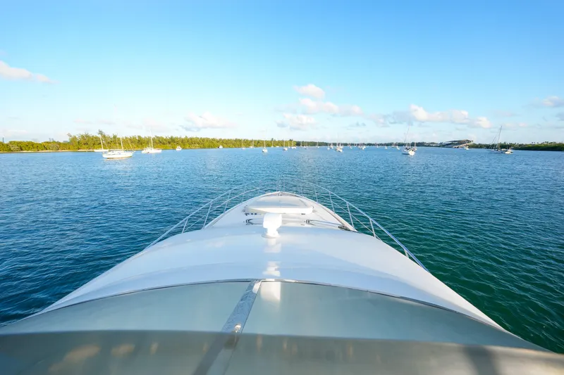 Slide: The Image of Azimut 68E yacht cruising on a serene blue waterway, 2007 model. - 28