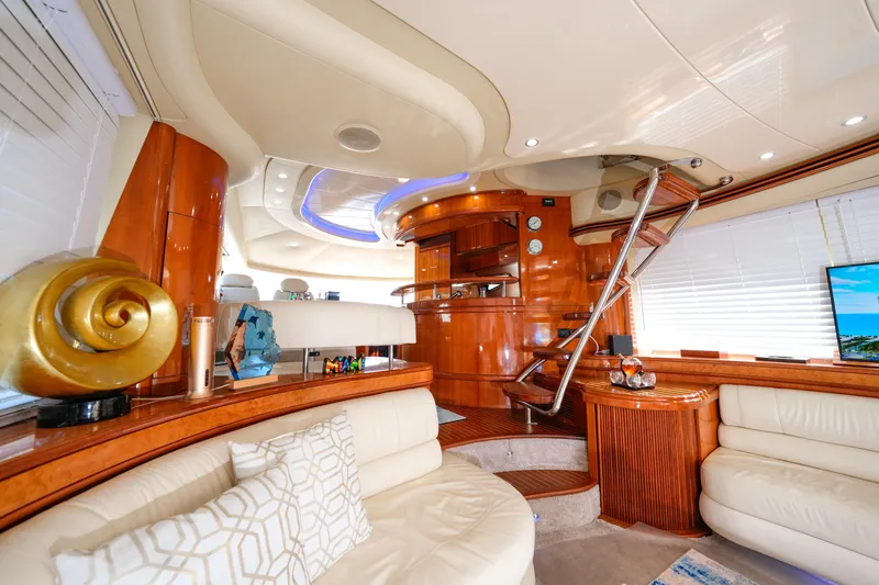 Slide: The Image of Luxurious interior of a 2007 Azimut 68E yacht with elegant wood finishes and plush seating. - 39