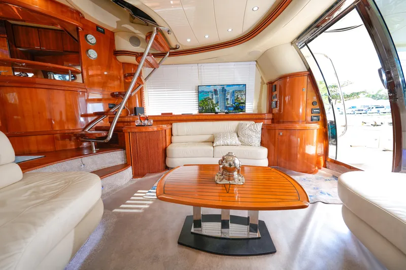 Slide: The Image of Luxurious interior of a 2007 Azimut 68E yacht with elegant wood finishes and plush seating. - 41