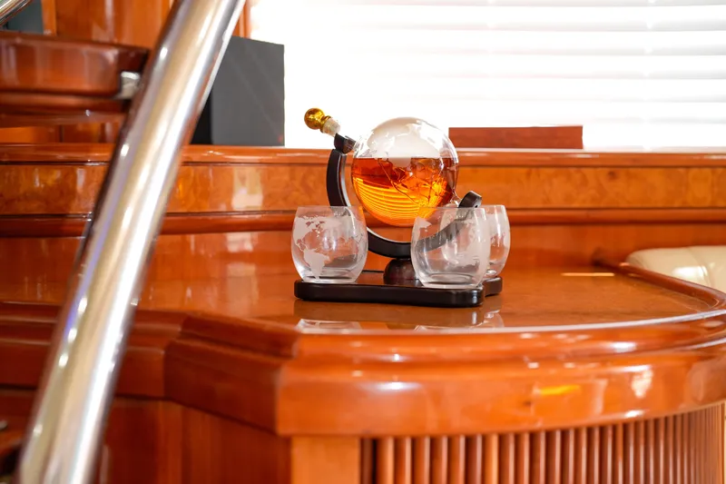 Slide: The Image of Luxurious interior of 2007 Azimut 68E yacht with elegant glassware on wooden surface. - 45