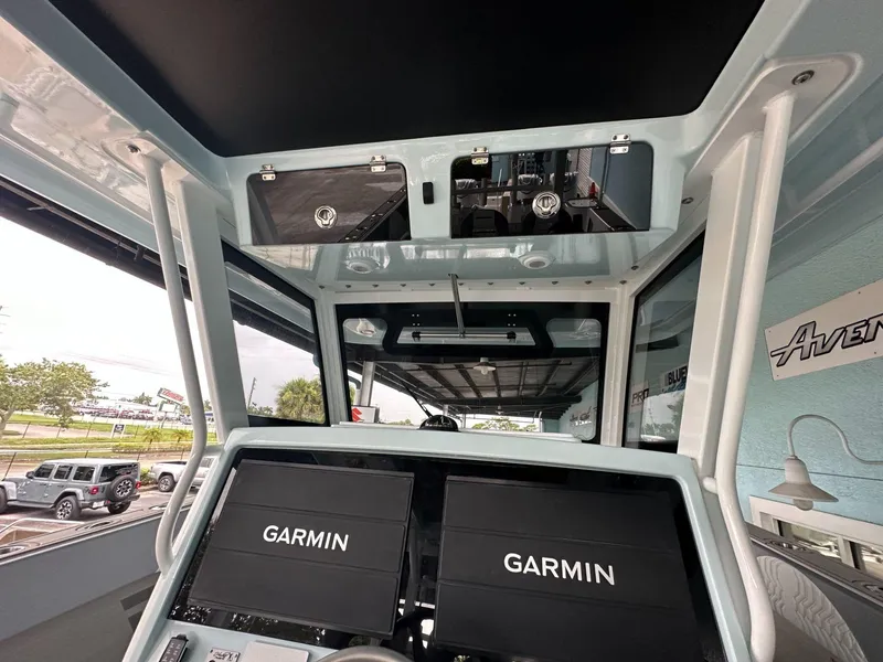 Slide: The Image of Interior view of 2025 Twin Vee 400 GFX2 CC boat with Garmin navigation displays. - 10