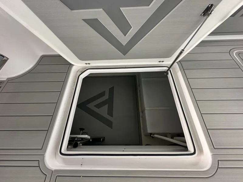 Slide: The Image of 2025 Twin Vee 400 GFX2 CC boat hatch with sleek, modern design and geometric pattern. - 16