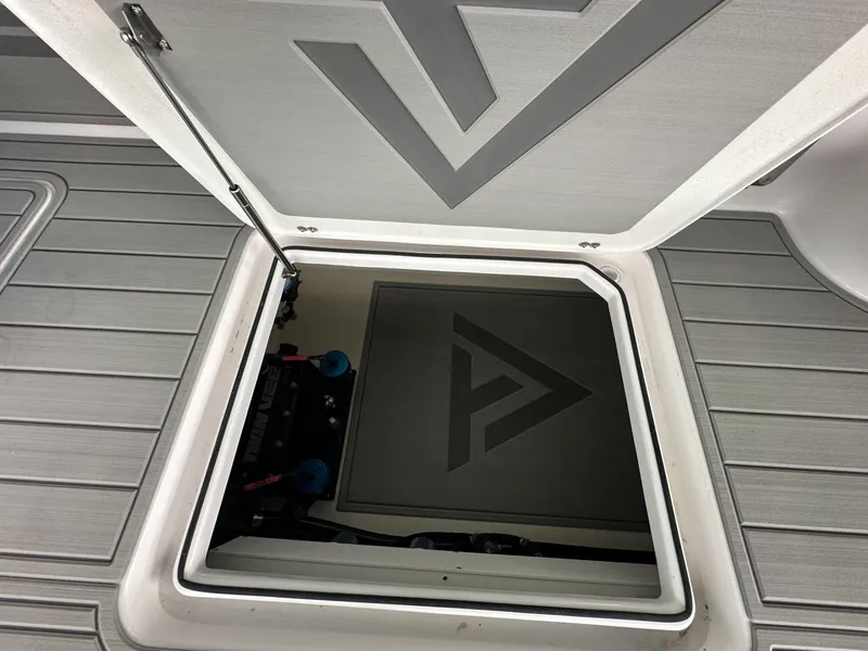 Slide: The Image of Hatch of 2025 Twin Vee 400 GFX2 CC boat, showcasing sleek design and storage. - 17