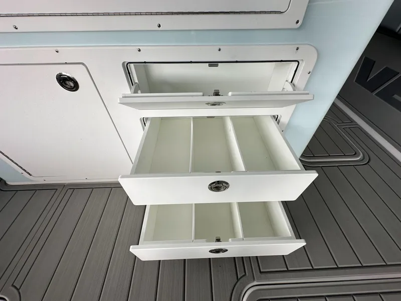 Slide: The Image of Open storage drawers on 2025 Twin Vee 400 GFX2 CC boat. - 21