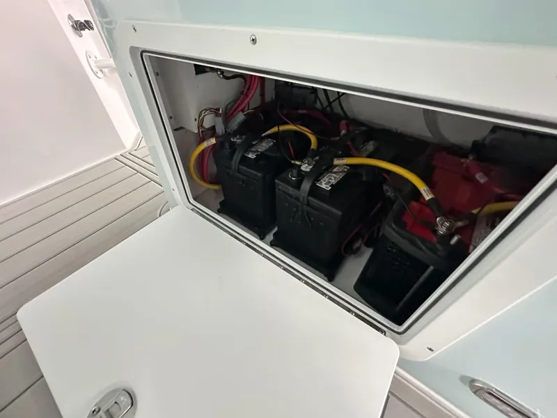 Slide: The Image of Battery compartment of 2025 Twin Vee 400 GFX2 CC boat, showing wiring and connections. - 28