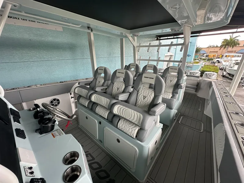 Slide: The Image of 2025 Twin Vee 400 GFX2 CC boat interior with luxurious seating and modern design. - 30