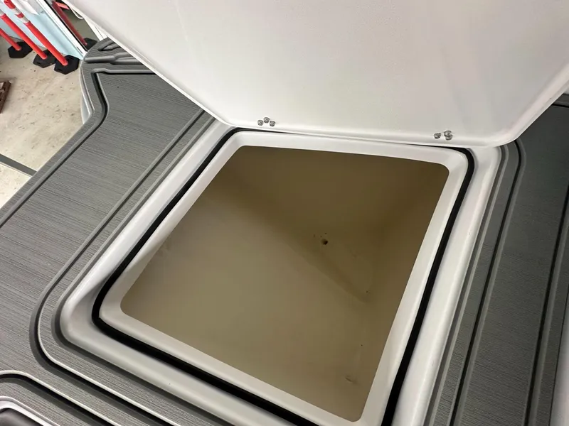 Slide: The Image of Open storage compartment on 2025 Twin Vee 400 GFX2 CC boat. - 34