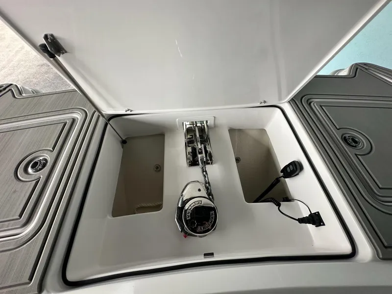 Slide: The Image of 2025 Twin Vee 400 GFX2 CC anchor compartment with chain and storage spaces. - 36