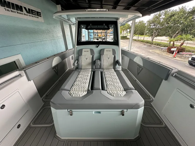 Slide: The Image of 2025 Twin Vee 400 GFX2 CC boat interior with modern seating and sleek design. - 40