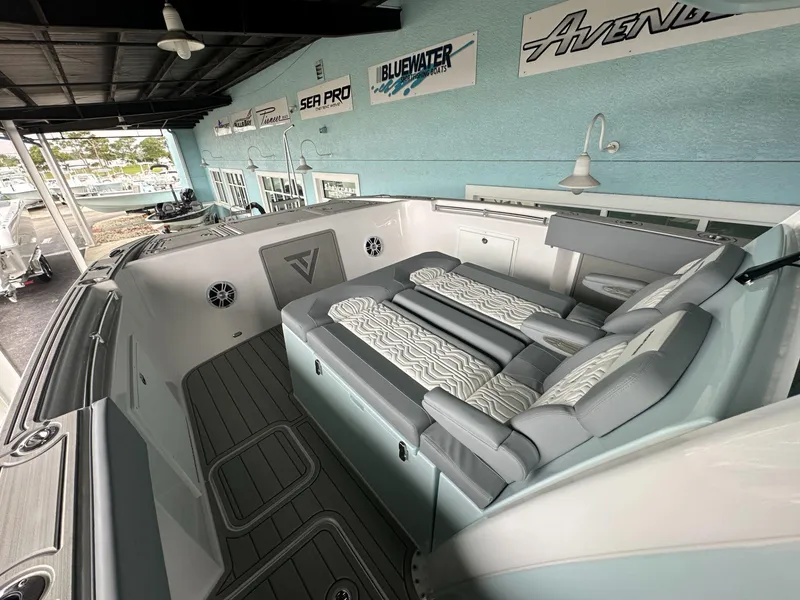 Slide: The Image of 2025 Twin Vee 400 GFX2 CC boat interior with cushioned seating and modern design. - 41