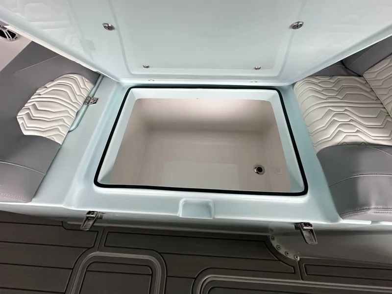 Slide: The Image of 2025 Twin Vee 400 GFX2 CC boat storage compartment with cushioned seating. - 44