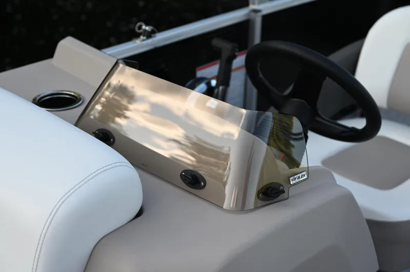 Slide: The Image of 2025 Princecraft Vectra 23 RL boat dashboard with steering wheel and windshield. - 7