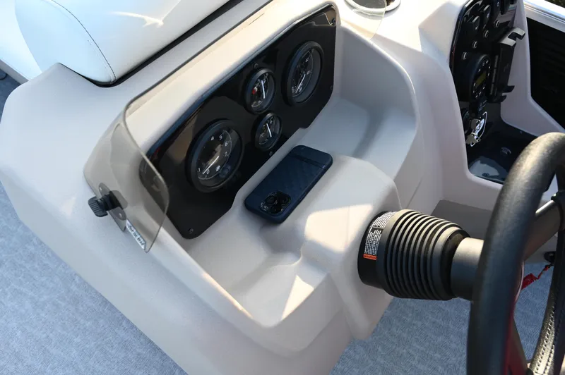 Slide: The Image of Control panel of 2025 Princecraft Vectra 23 RL boat with gauges and smartphone holder. - 8