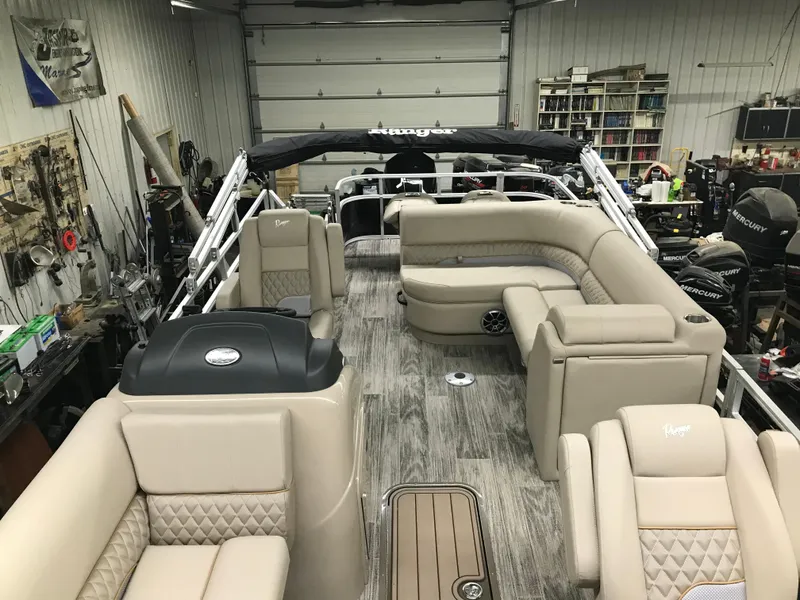 Slide: The Image of 2025 Ranger Reata 223FC boat engine in a workshop setting. - 10