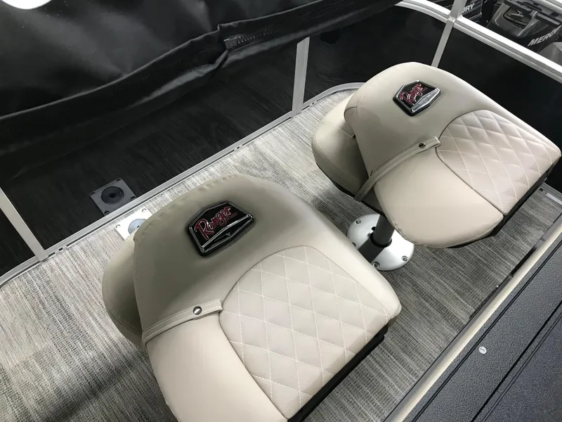 Slide: The Image of 2025 Ranger Reata 223FC boat interior with carpeted flooring and metal ladder. - 15