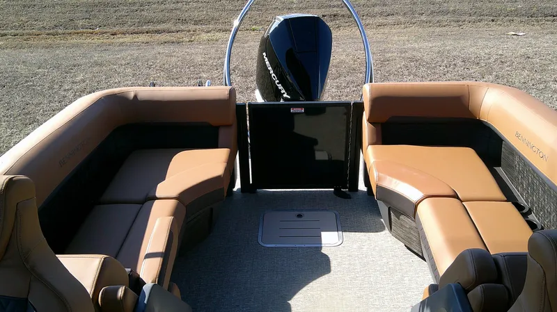 Slide: The Image of 2025 Bennington MFB 26 boat interior with tan seating and modern design. - 9