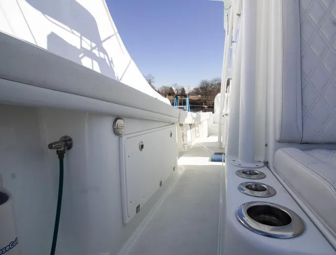 Slide: The Image of 2018 Yellowfin 36 boat interior with rod holders and storage compartments. - 10