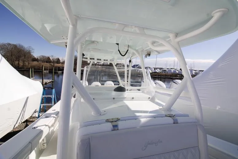 Slide: The Image of 2018 Yellowfin 36 boat interior with white seating and sturdy framework. - 11