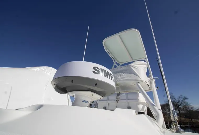 Slide: The Image of 2018 Yellowfin 36 boat with Simrad radar, clear sky background. - 12