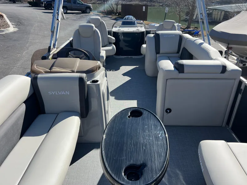 Slide: The Image of 2025 Sylvan Mirage Fish 8522 Party Fish pontoon boat interior with seating and table. - 23