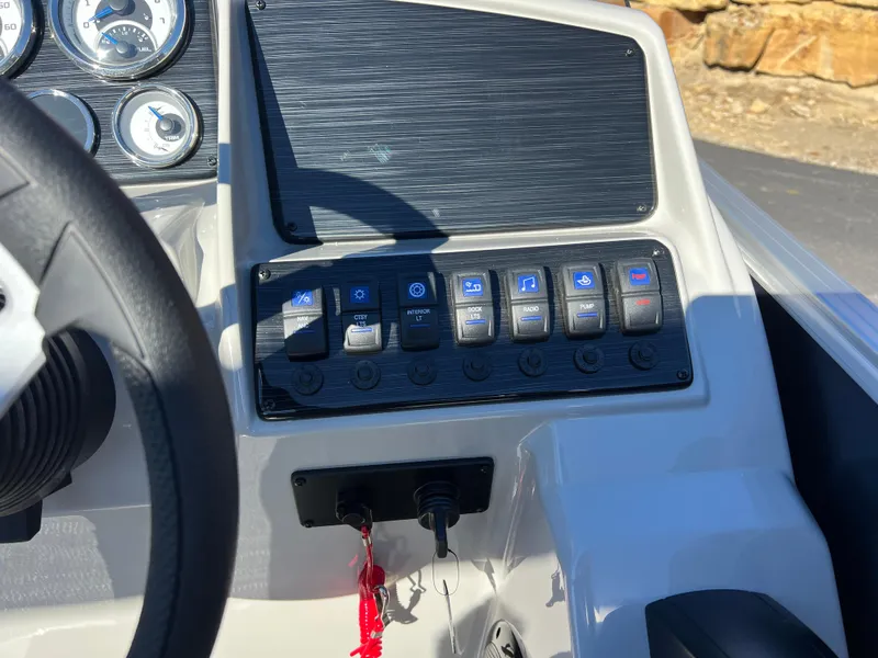 Slide: The Image of Control panel of 2025 Sylvan Mirage Fish 8522 Party Fish boat with switches and gauges. - 40